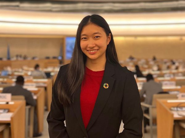 Young woman smiling in in a conference room