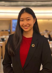 Young woman smiling in in a conference room