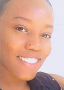 A woman smiling brightly