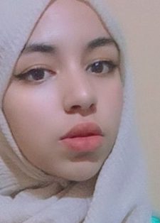 Young woman wearing a beige hijab