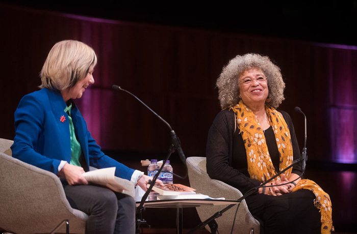 Jude Kelly and Angela Davis sit on stage at WOW London in 2019